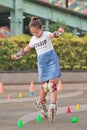 Lovely Chinese girl practicing inline skating, Beijing, China